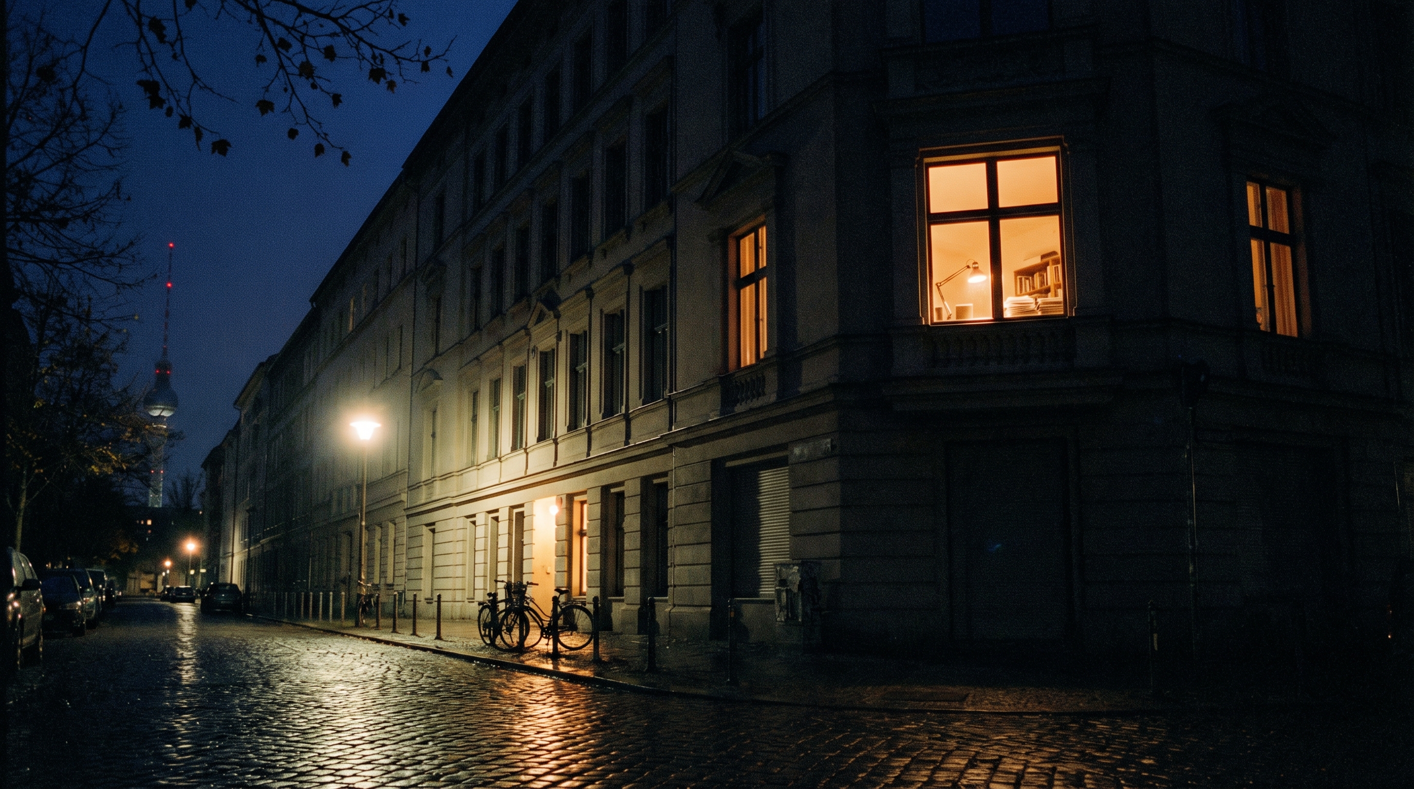 Berlin engineering studio interior — tall windows, concrete and wood